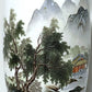 Decorative vase with a landscape design featuring trees and a building.
